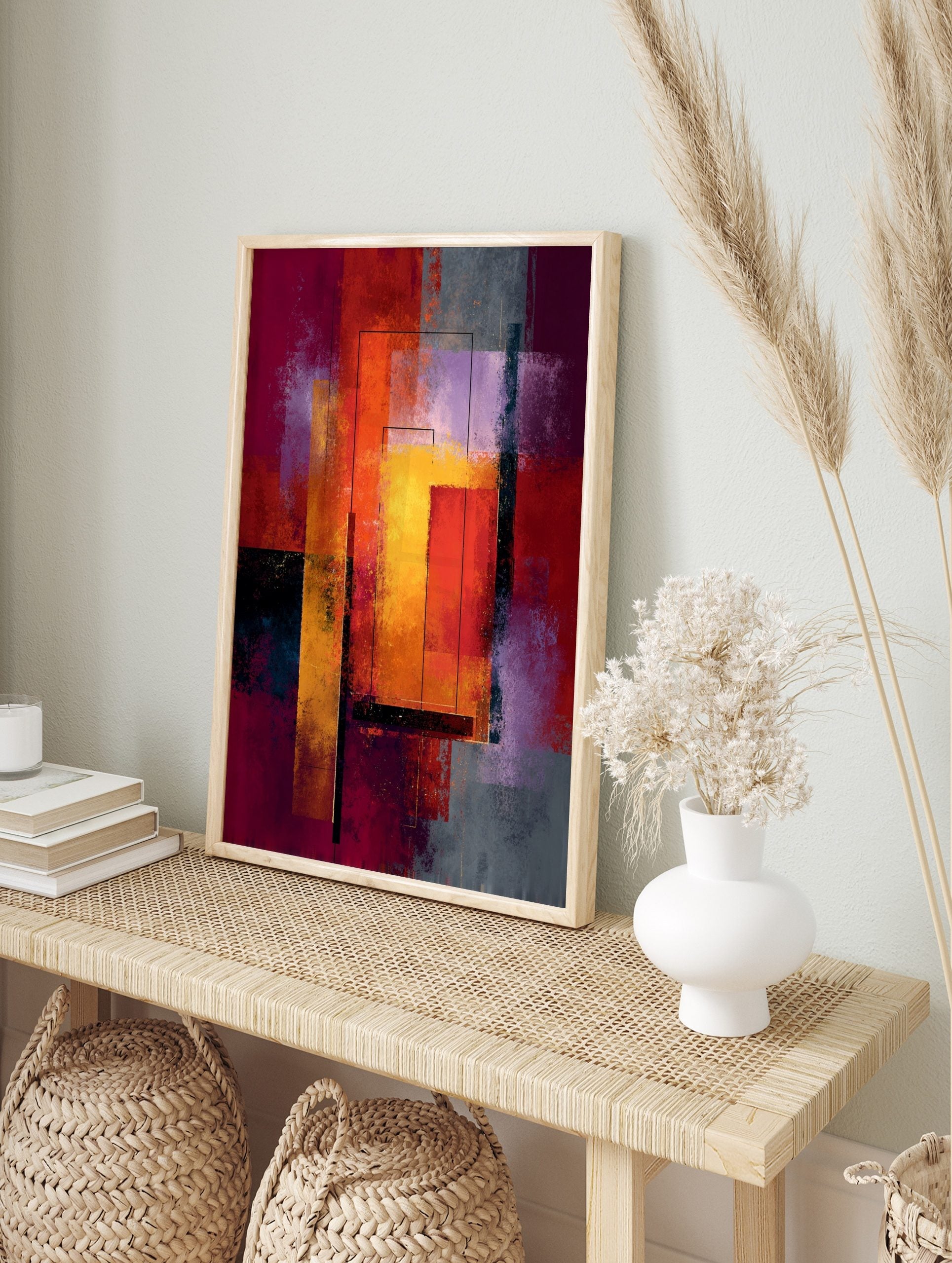 Abstract geometric art print with layered rectangles in red, orange, yellow, and purple with, in an alternate framed mockup