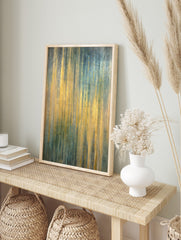 Abstract art print with shimmering vertical gold, teal, and blue stripes, featuring a, in an alternate framed mockup