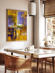 Abstract art print with textured gold, purple, and brown paint strokes in a layered, modern, in a styled room mockup