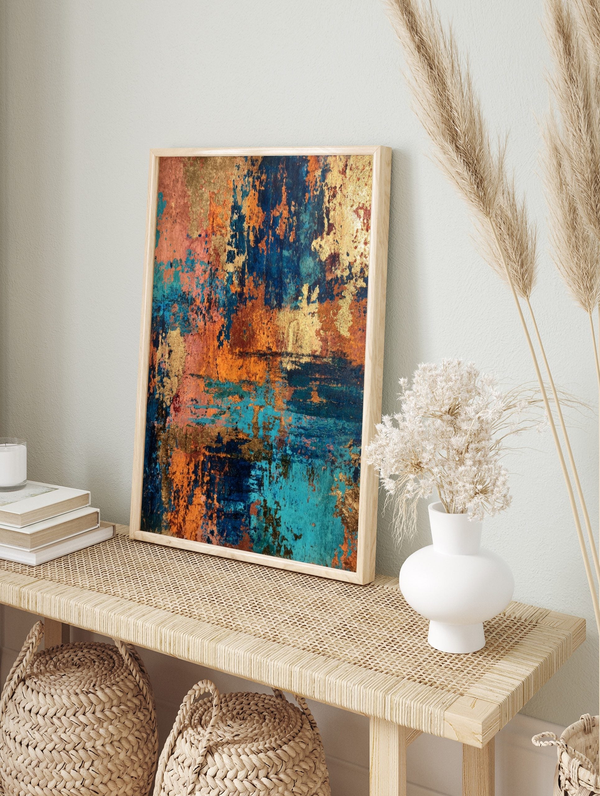 Abstract textured wall art with metallic gold, deep teal, and burnt orange colours, in an alternate framed mockup