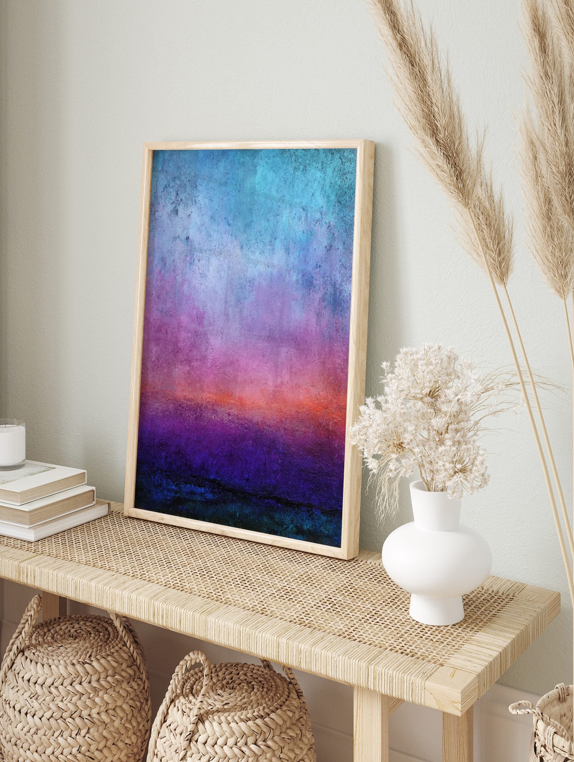 Abstract gradient art print with textured bands of blue, purple, orange, and deep teal, in an alternate framed mockup