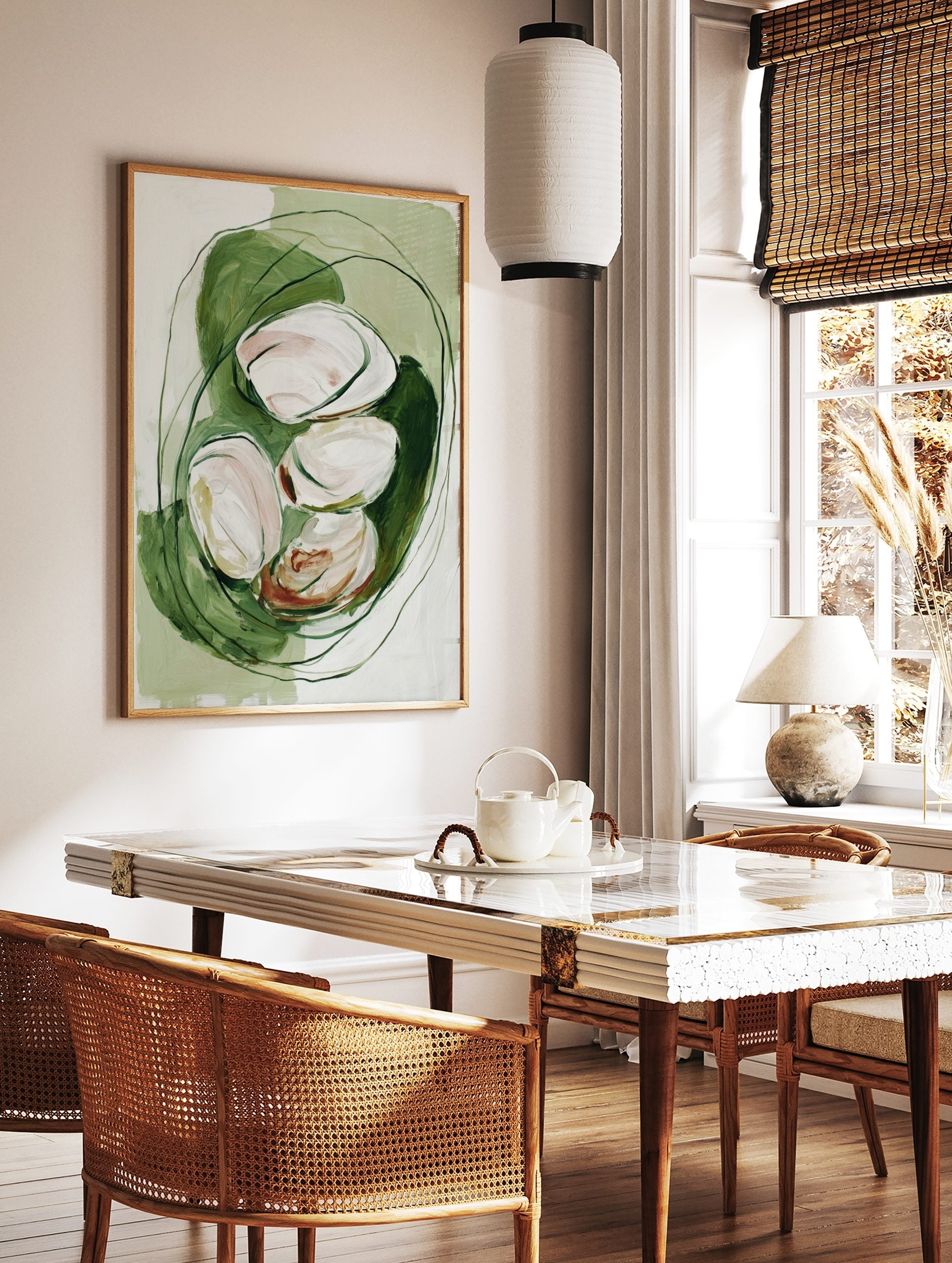 Abstract painterly art print with white and blush organic shapes nestled in green brushstrokes and, in a styled room mockup