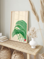 Abstract green grass-like shapes with sweeping curves and a small red square on a cream, in an alternate framed mockup