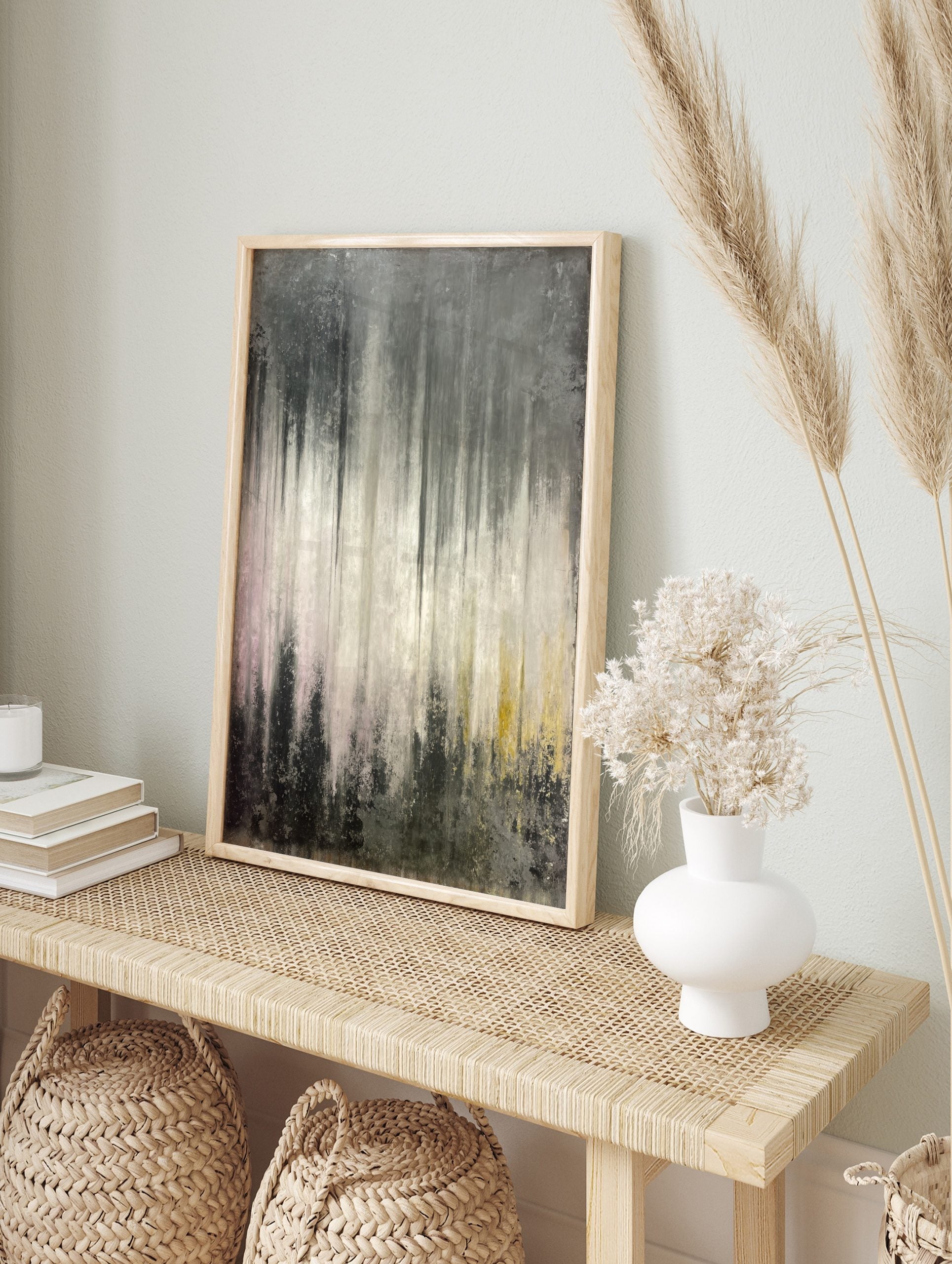 Abstract grey and white wall art with vertical dripped textures and subtle pink and yellow, in an alternate framed mockup