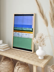 Abstract painting with horizontal bands of blue, green, white, gold, and black with visible, in an alternate framed mockup