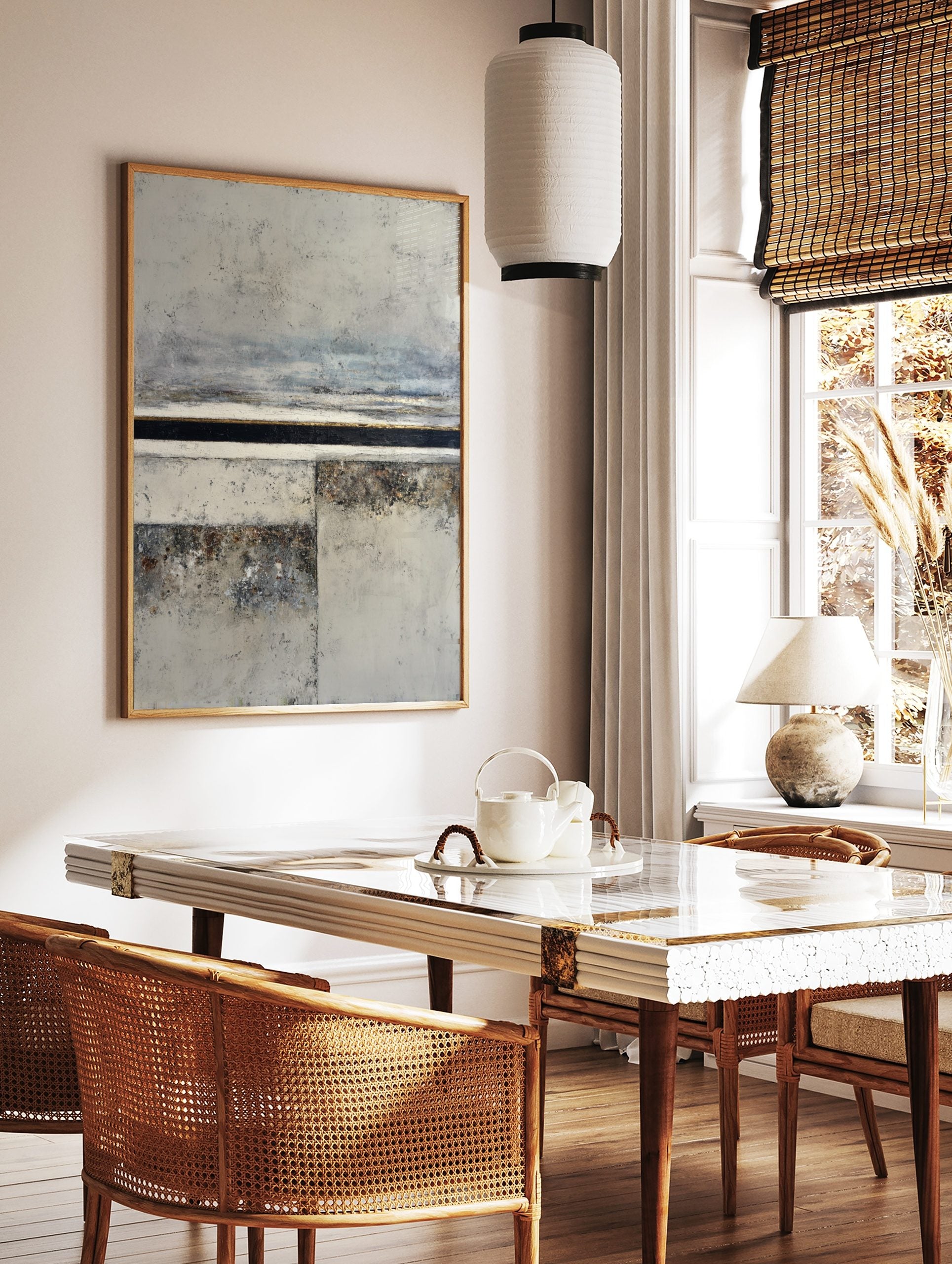 Abstract textured landscape wall art print with grey, off-white, black, and gold horizontal bands, in a styled room mockup