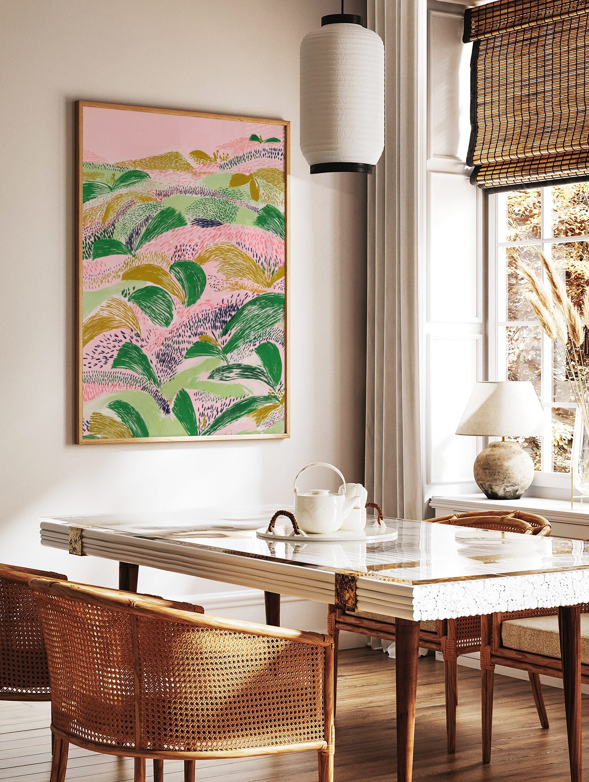 Abstract landscape illustration with textured green and gold foliage on a pink background, in a styled room mockup