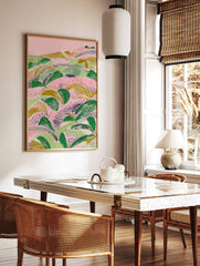 Abstract landscape illustration with textured green and gold foliage on a pink background, in a styled room mockup
