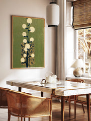 Abstract light tree illustration with glowing circles, dark branches, and ornate gold panel on, in a styled room mockup