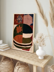 Abstract botanical wall art featuring a red maple leaf on a green and blue textured background, in an alternate framed mockup