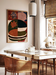 Abstract botanical wall art featuring a red maple leaf on a green and blue textured background, in a styled room mockup