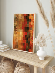 Abstract mosaic wall art with a grid of textured red, orange, and brown squares and vertical, in an alternate framed mockup