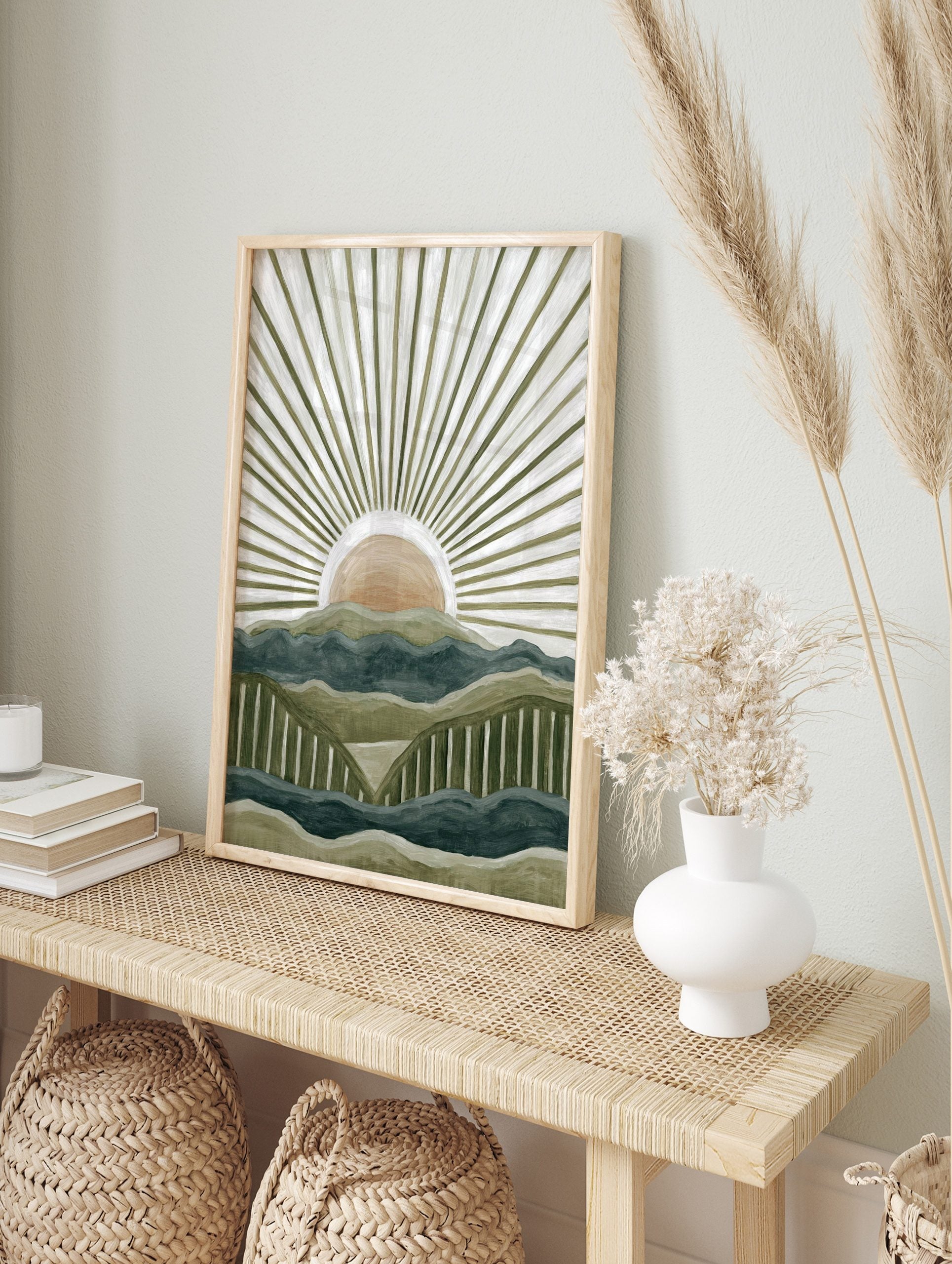 Abstract mountain landscape art print with layered green and blue peaks and a peach sun with, in an alternate framed mockup