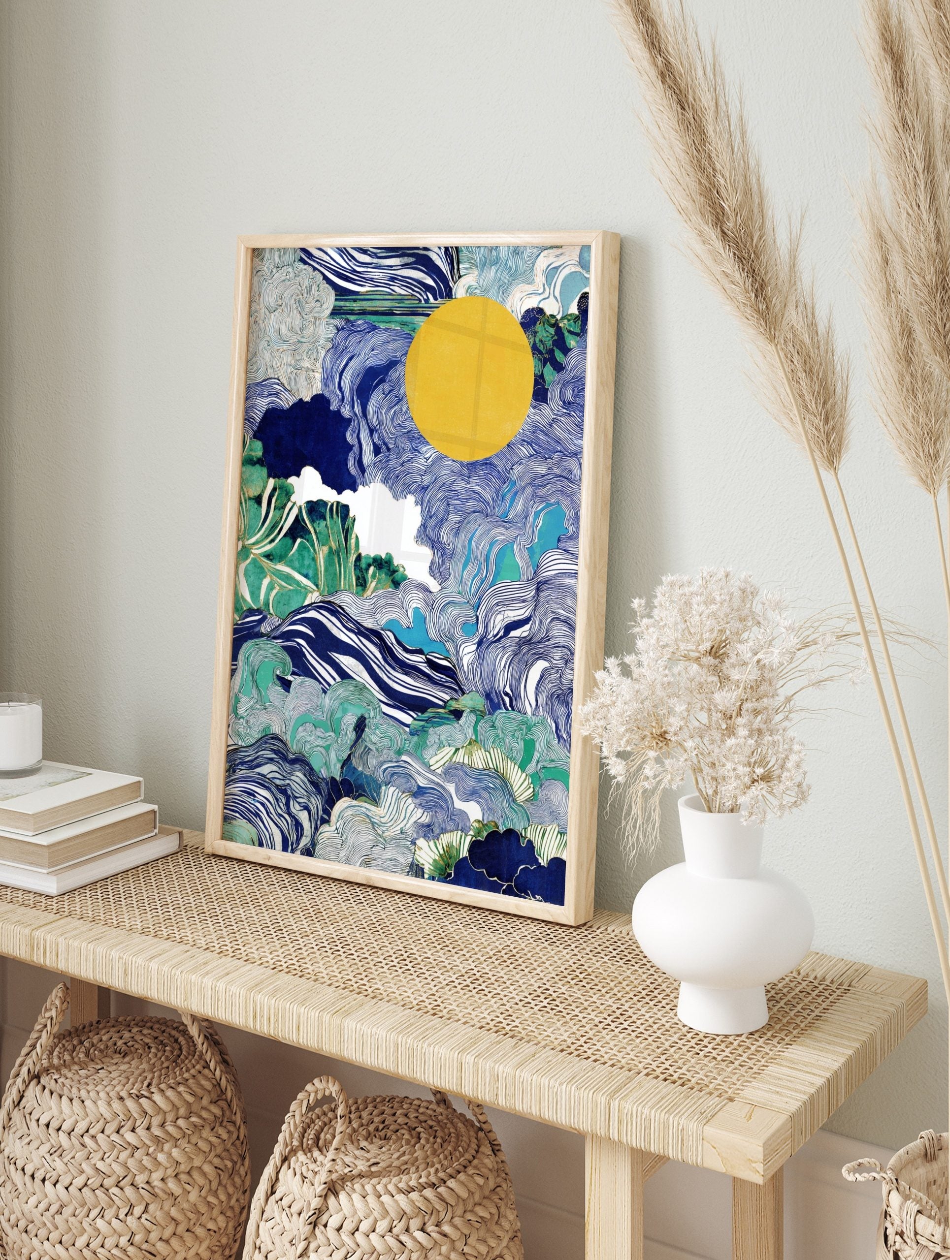 Abstract art print with swirling blue ocean waves, green foliage, white clouds, and a large, in an alternate framed mockup