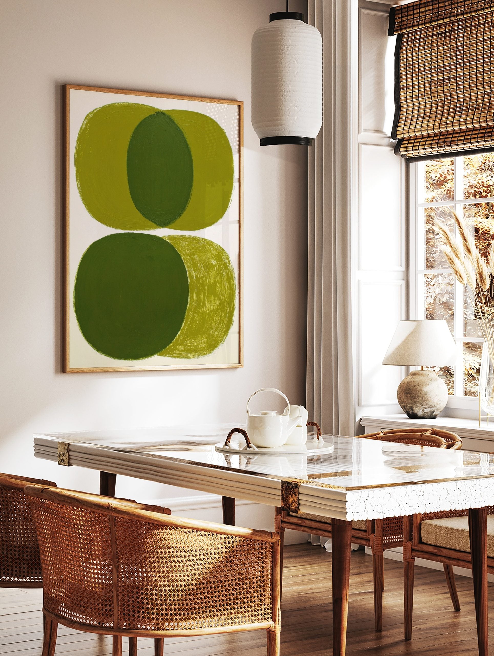 Abstract art print with overlapping olive green ovals and visible brushstrokes on white background, in a styled room mockup