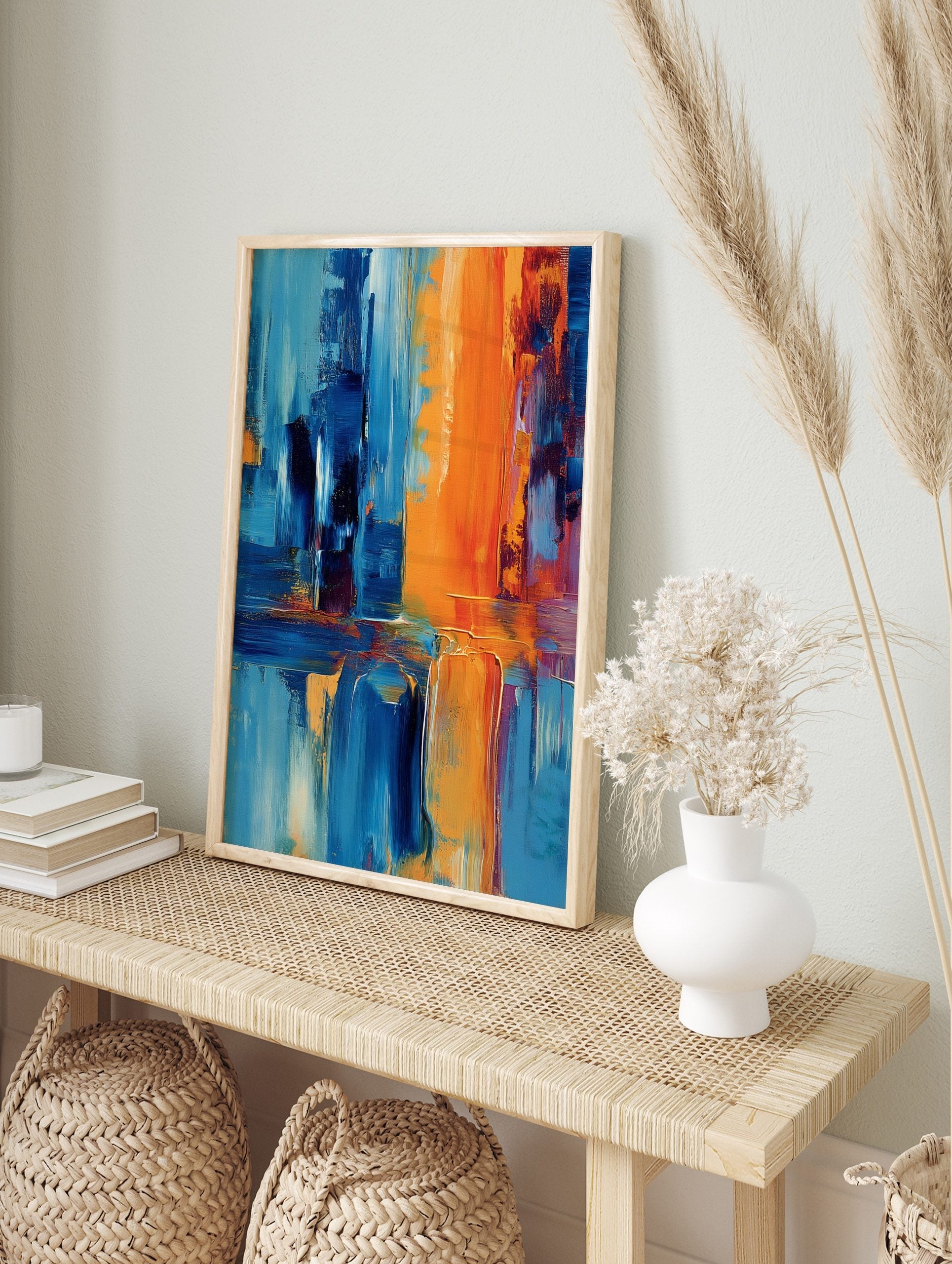 Abstract art print with bold vertical and horizontal strokes in orange and shades of blue, in an alternate framed mockup