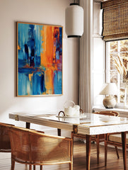 Abstract art print with bold vertical and horizontal strokes in orange and shades of blue, showing, in a styled room mockup