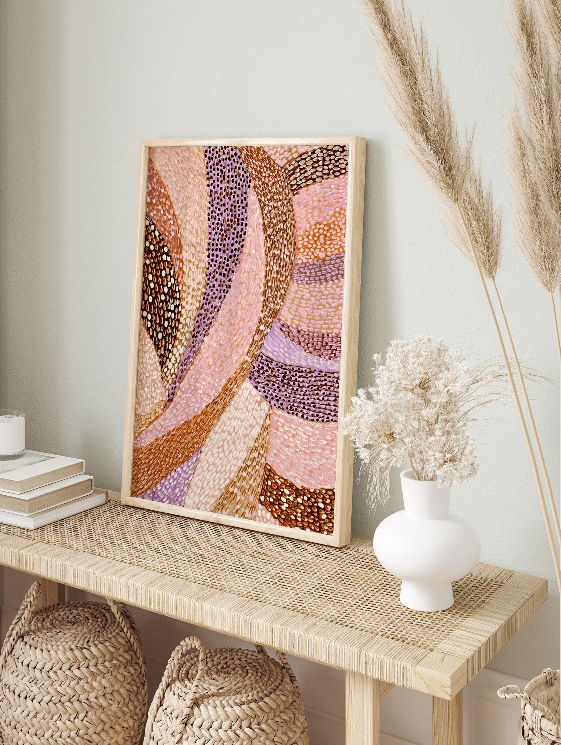 Abstract art print with flowing, curved bands of brown, pink, and lavender, featuring dotted, in an alternate framed mockup