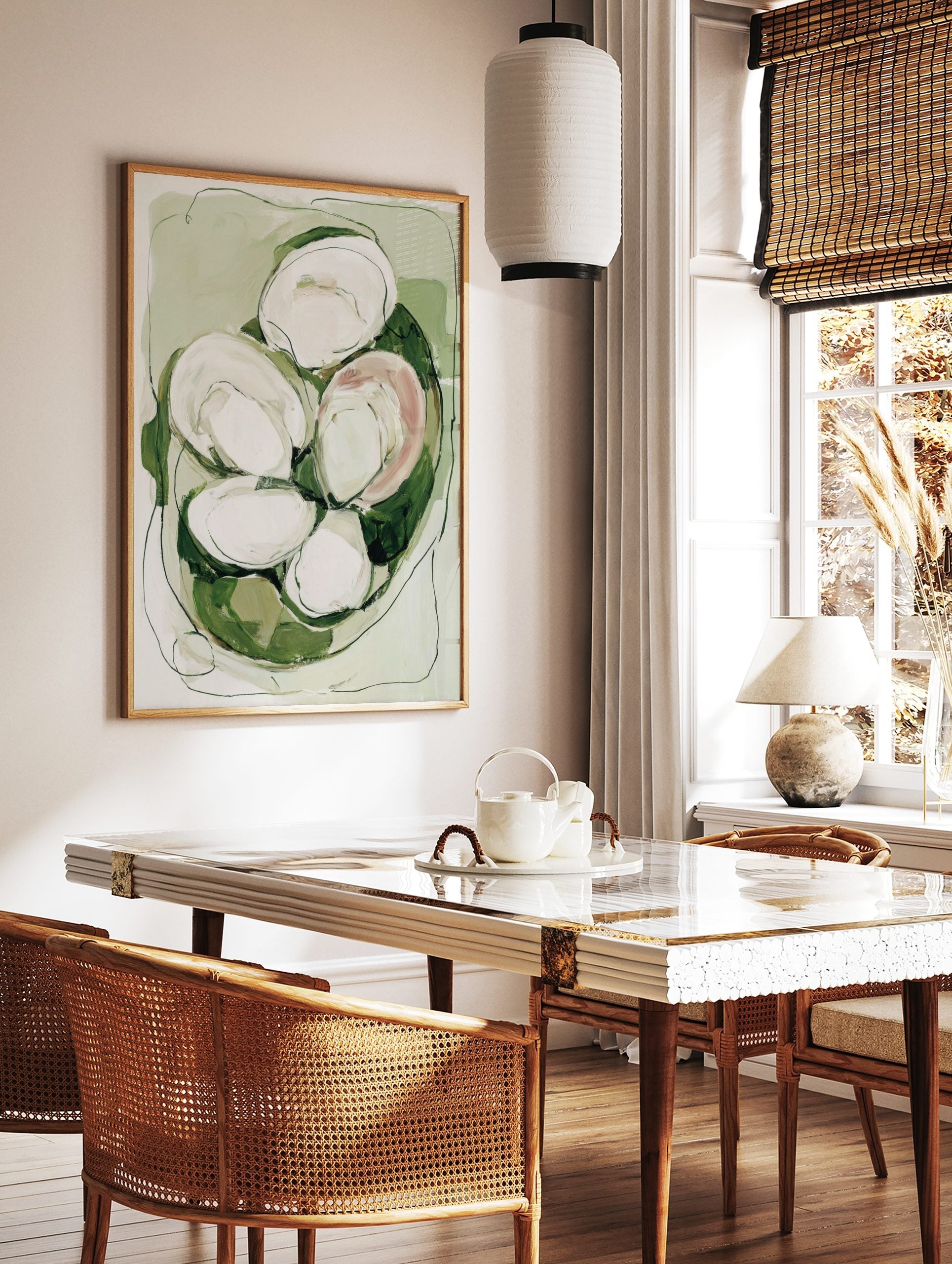 Abstract oyster shell wall art in green, white, and blush with organic shapes and dark outlines, in a styled room mockup