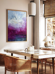 Abstract painting with textured layers of deep magenta, purple, white, and blue, creating an, in a styled room mockup