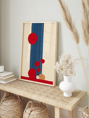 Abstract art print with large and small red circles, a navy blue vertical stripe with white, in an alternate framed mockup