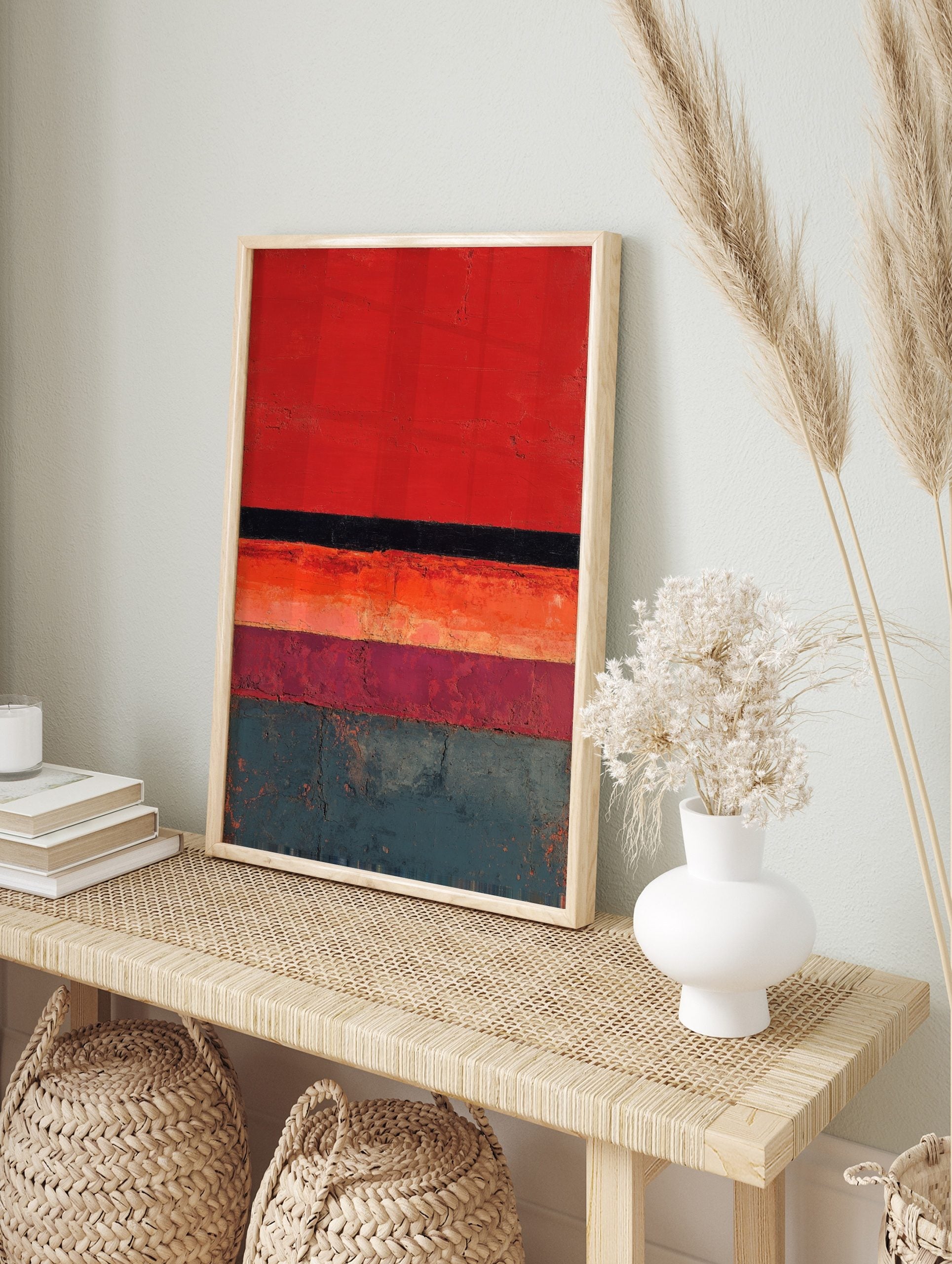 Abstract textured wall art with horizontal stripes in red, black, orange, plum, and teal, in an alternate framed mockup