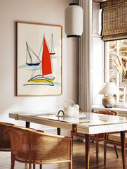 Minimalist abstract sailboat wall art with red, blue, and yellow sails and black line work on a, in a styled room mockup