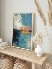 Abstract seascape art print with textured blues, oranges, and white, depicting a sunset over, in an alternate framed mockup