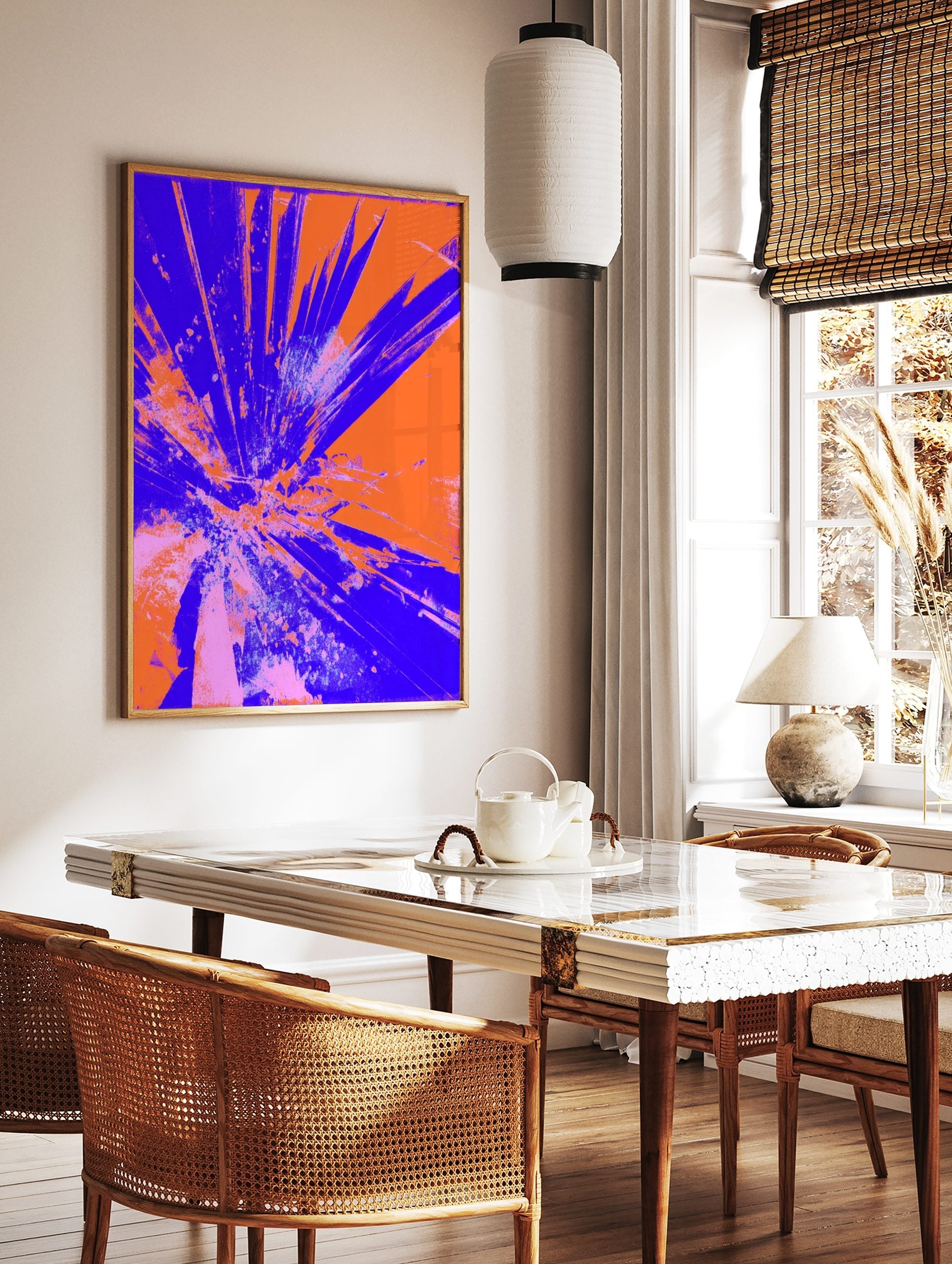 Abstract art print with radiating blue and orange shattered glass or explosive burst effect on a, in a styled room mockup
