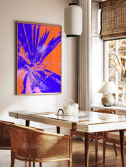 Abstract art print with radiating blue and orange shattered glass or explosive burst effect on a, in a styled room mockup
