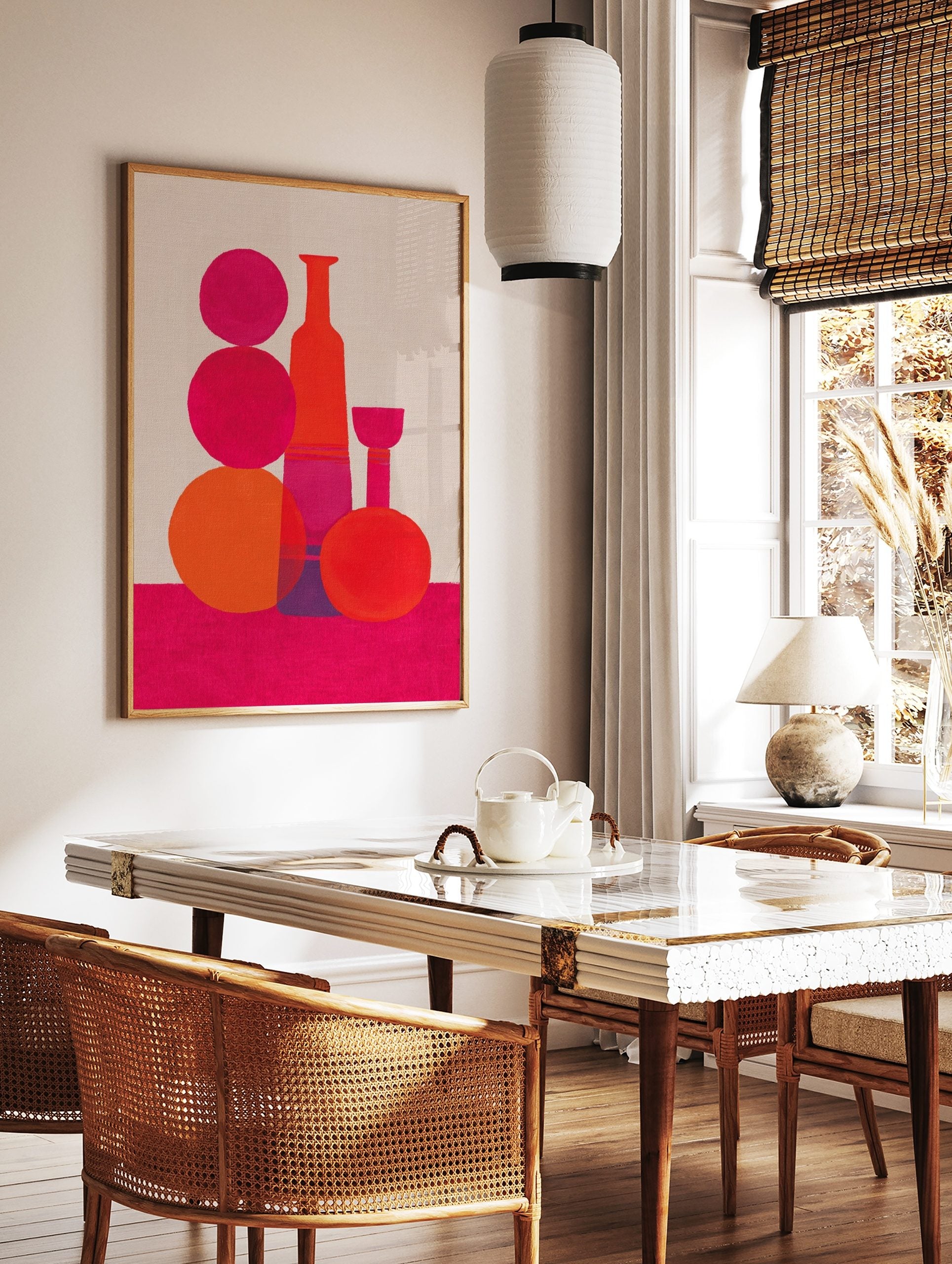 Abstract still life art print with pink and orange geometric bottle and sphere shapes on a fuchsia, in a styled room mockup