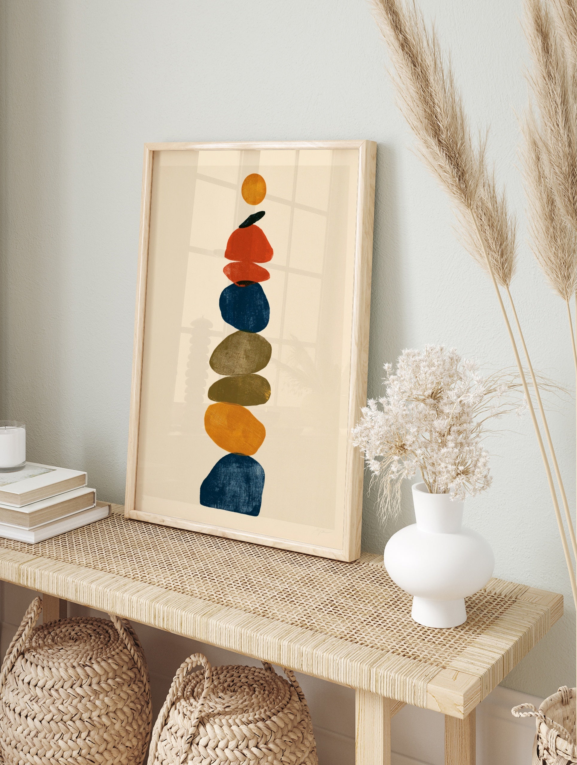 Abstract stone stack wall art print featuring vertical layered rounded shapes in blue, in an alternate framed mockup