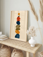 Abstract stone stack wall art print featuring vertical layered rounded shapes in blue, in an alternate framed mockup