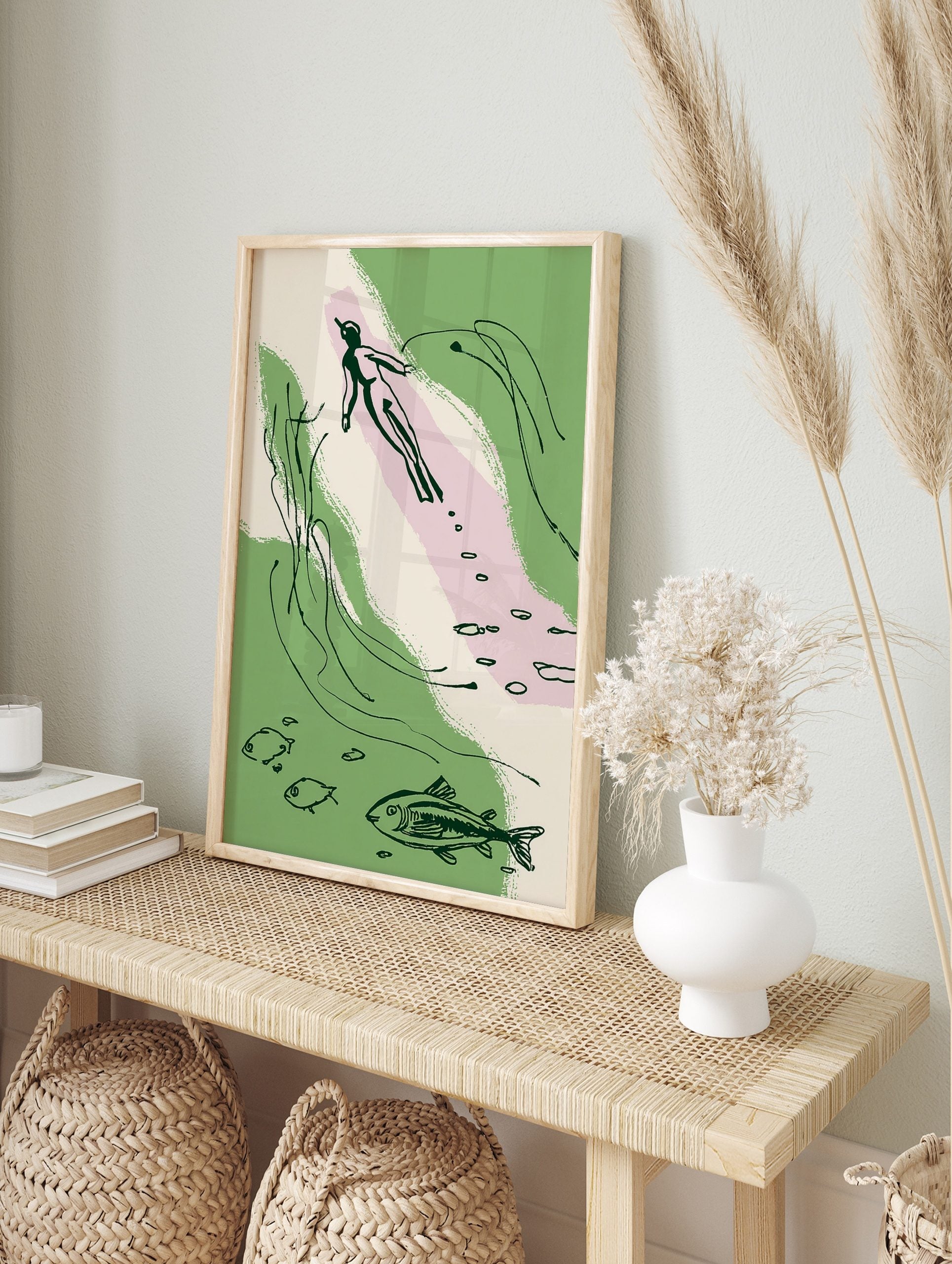 Abstract illustration of an underwater swimmer with fish and aquatic plants in green, pink, in an alternate framed mockup