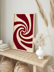 Abstract swirling pattern wall art in deep red and cream, with smooth, curved lines creating, in an alternate framed mockup
