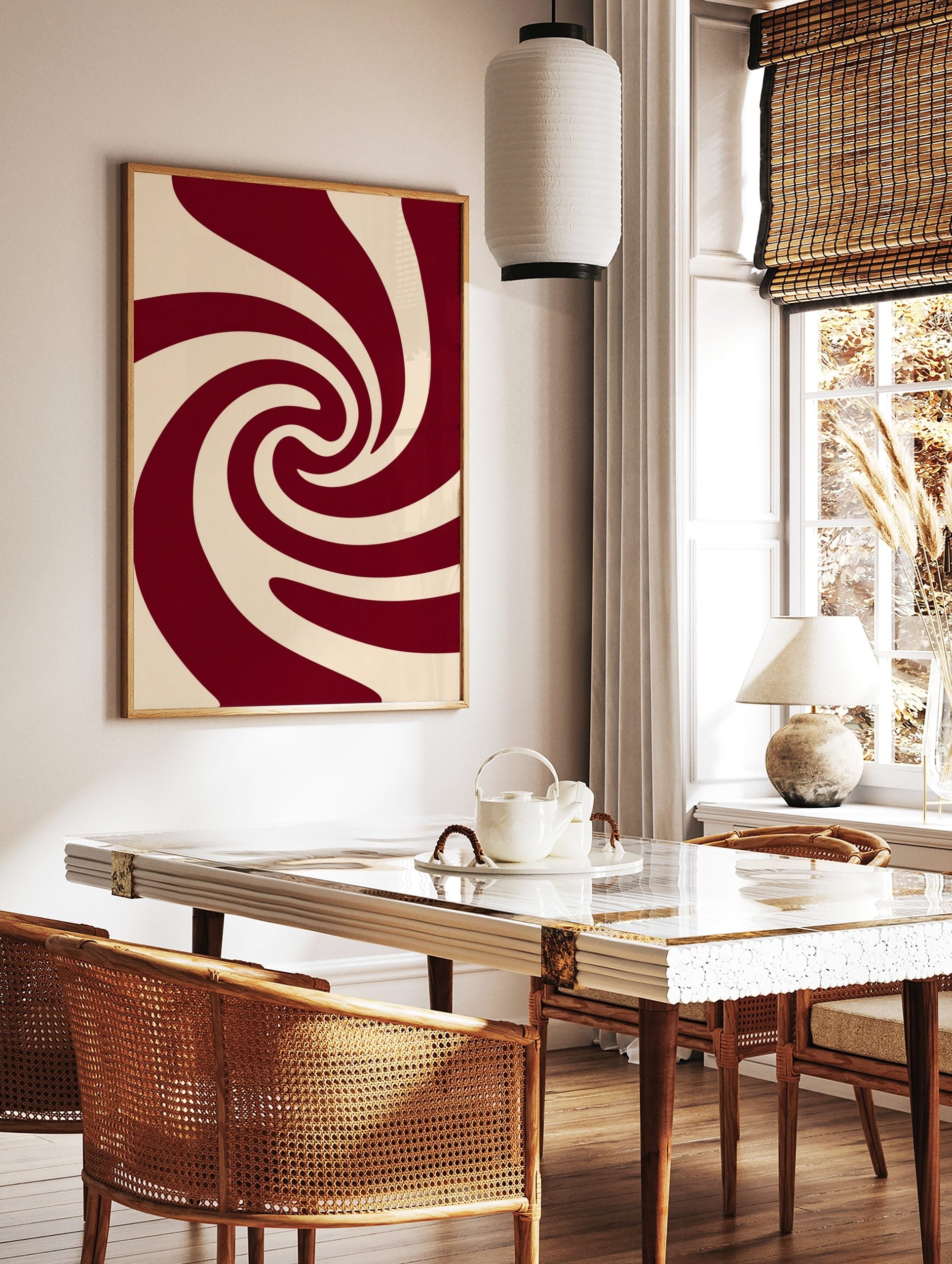 Abstract swirling pattern wall art in deep red and cream, with smooth, curved lines creating a, in a styled room mockup