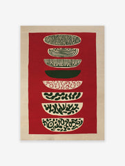 Abstract tapestry wall hanging with stacked red, green, and beige patterned shapes on a textured background.