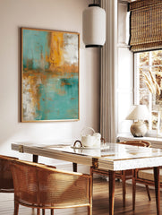 Abstract painting with textured vertical and horizontal strokes in teal, golden yellow, and white, in a styled room mockup