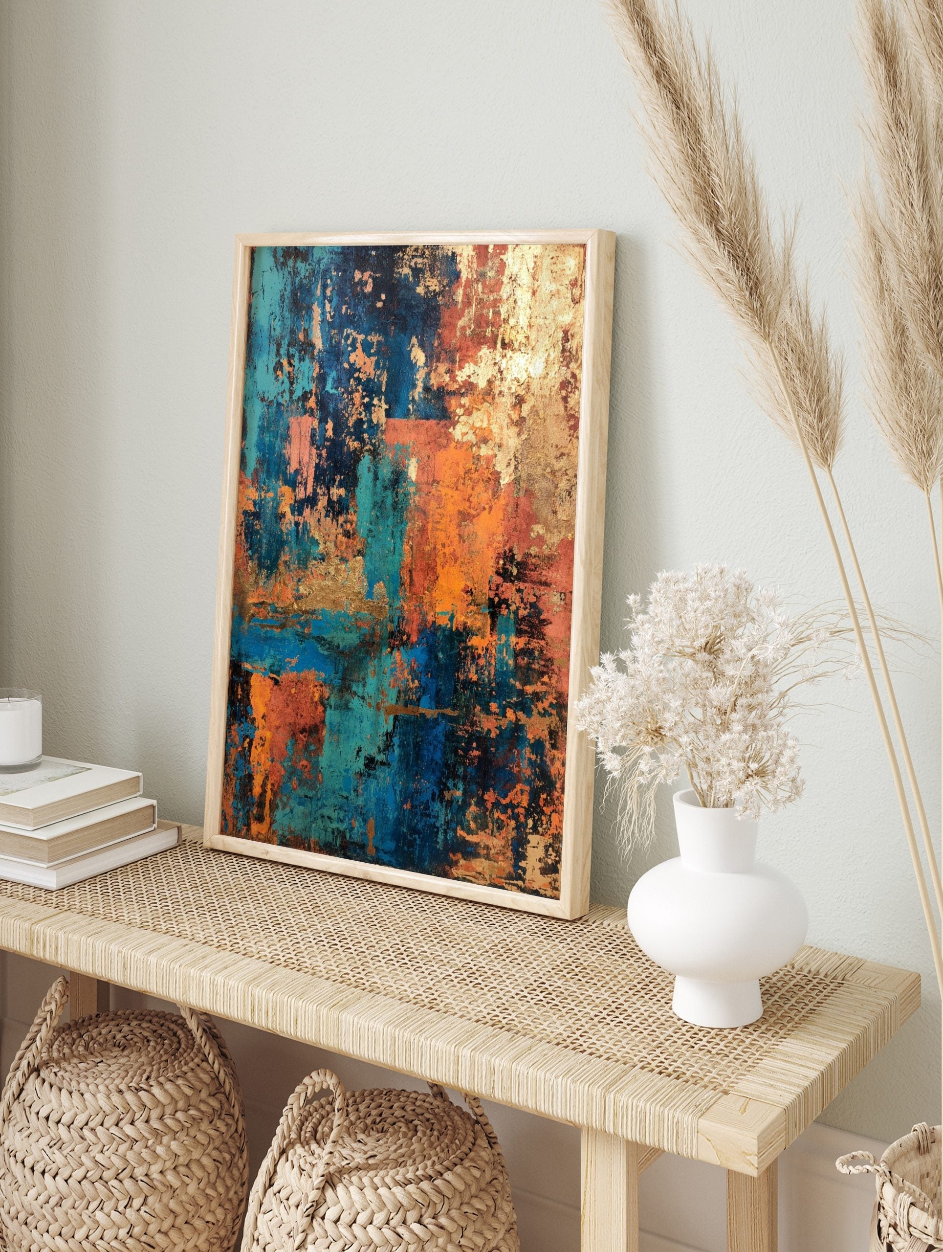 Abstract art print with distressed textures in teal, blue, orange, and gold, layered in a, in an alternate framed mockup