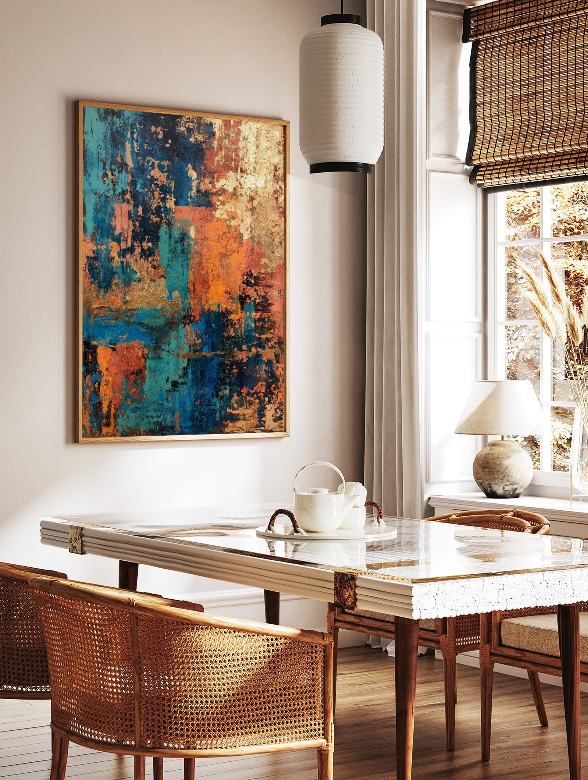 Abstract art print with distressed textures in teal, blue, orange, and gold, layered in a vertical, in a styled room mockup