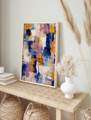 Abstract textured wall art with broad brushstrokes in navy blue, golden yellow, purple, and, in an alternate framed mockup
