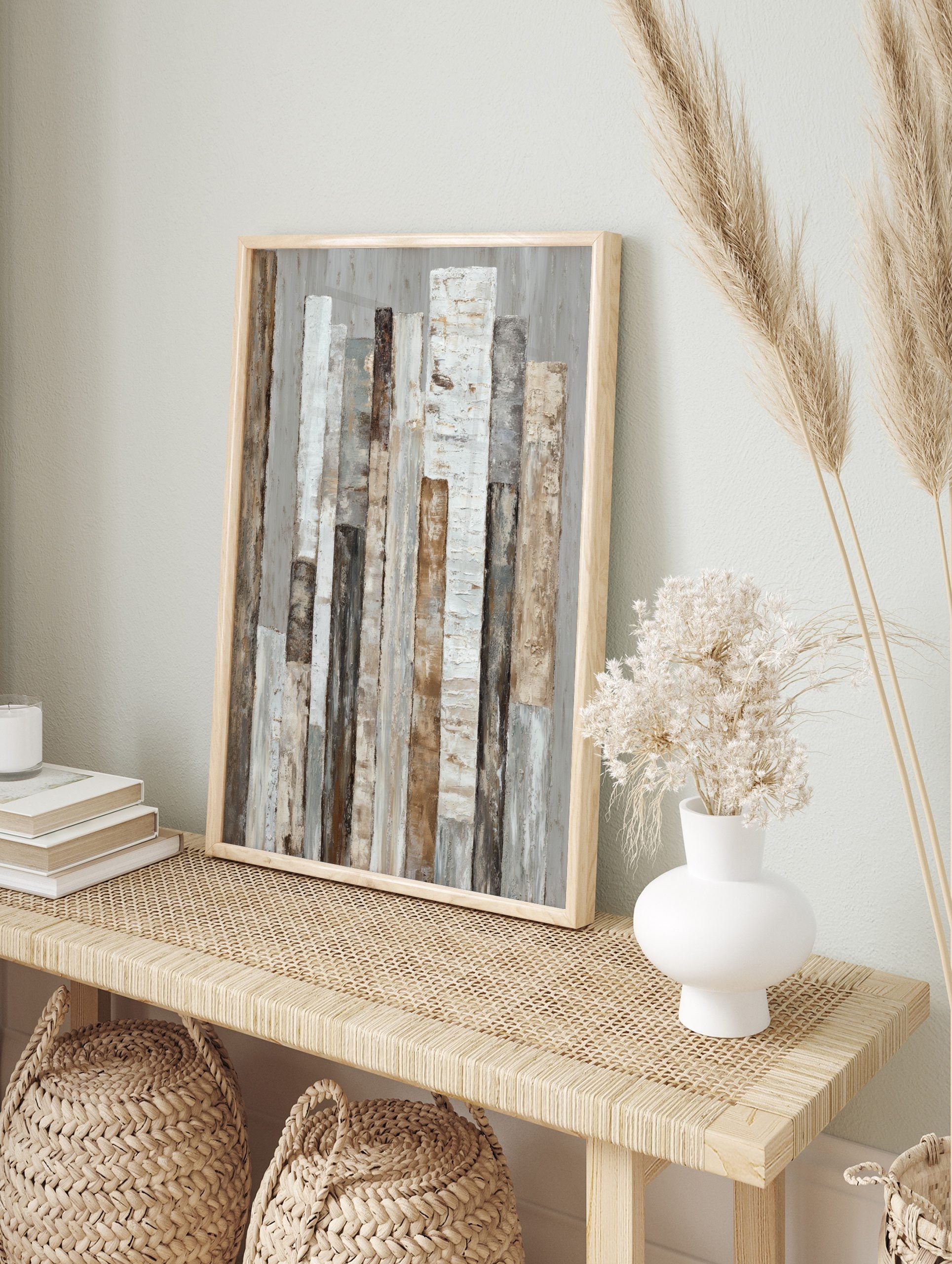 Abstract textured wall art with vertical strips in white, beige, brown, and grey tones on a, in an alternate framed mockup