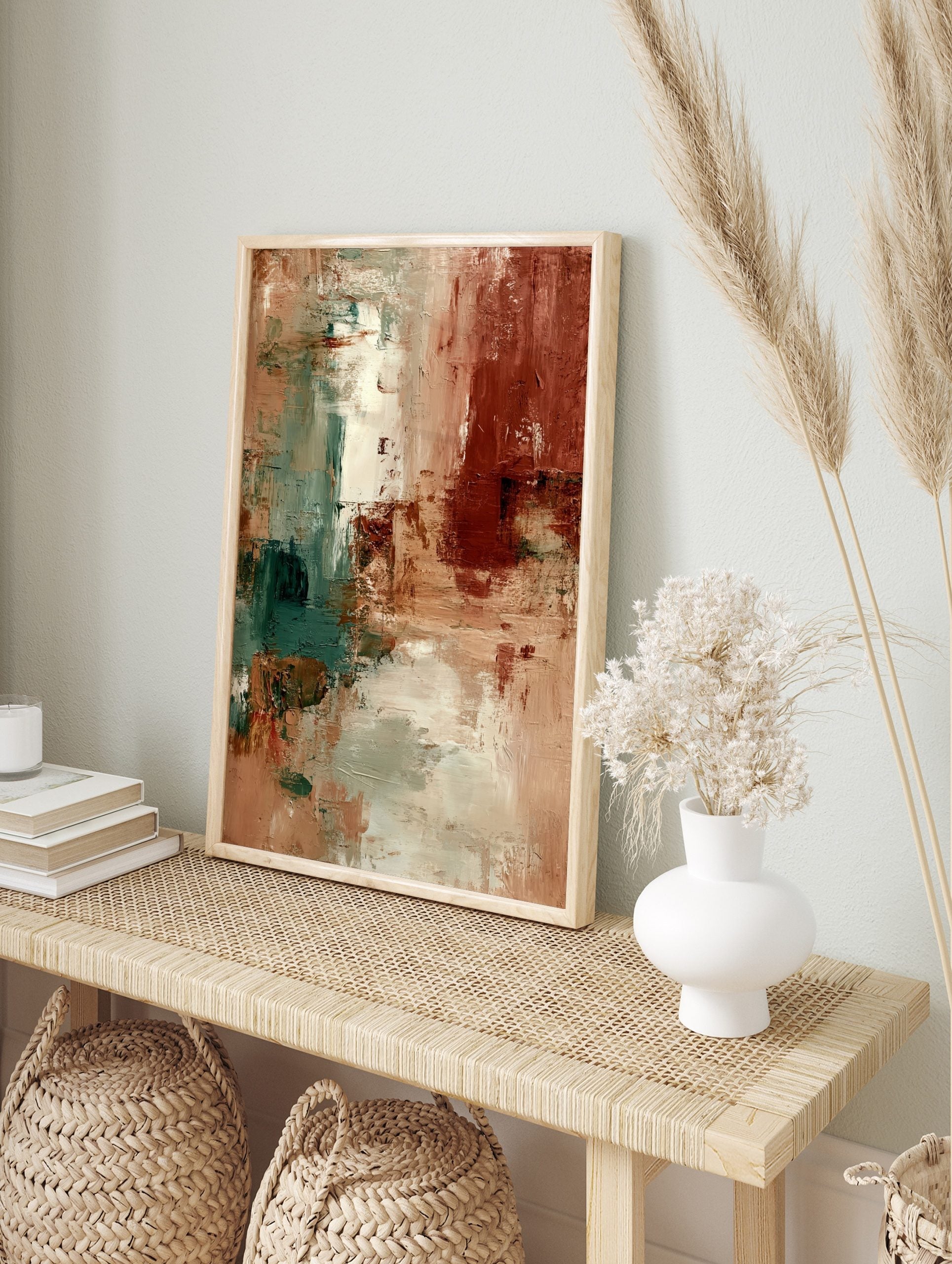 Abstract textured wall art with earthy beige, deep terracotta, and muted teal brushstrokes in, in an alternate framed mockup