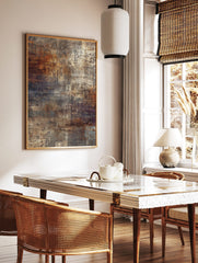 Abstract wall art print with distressed textures in rust orange, brown, grey, and cream colours, in a styled room mockup