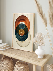 Abstract art print featuring three overlapping vinyl records in blue, brown, and grey tones, in an alternate framed mockup