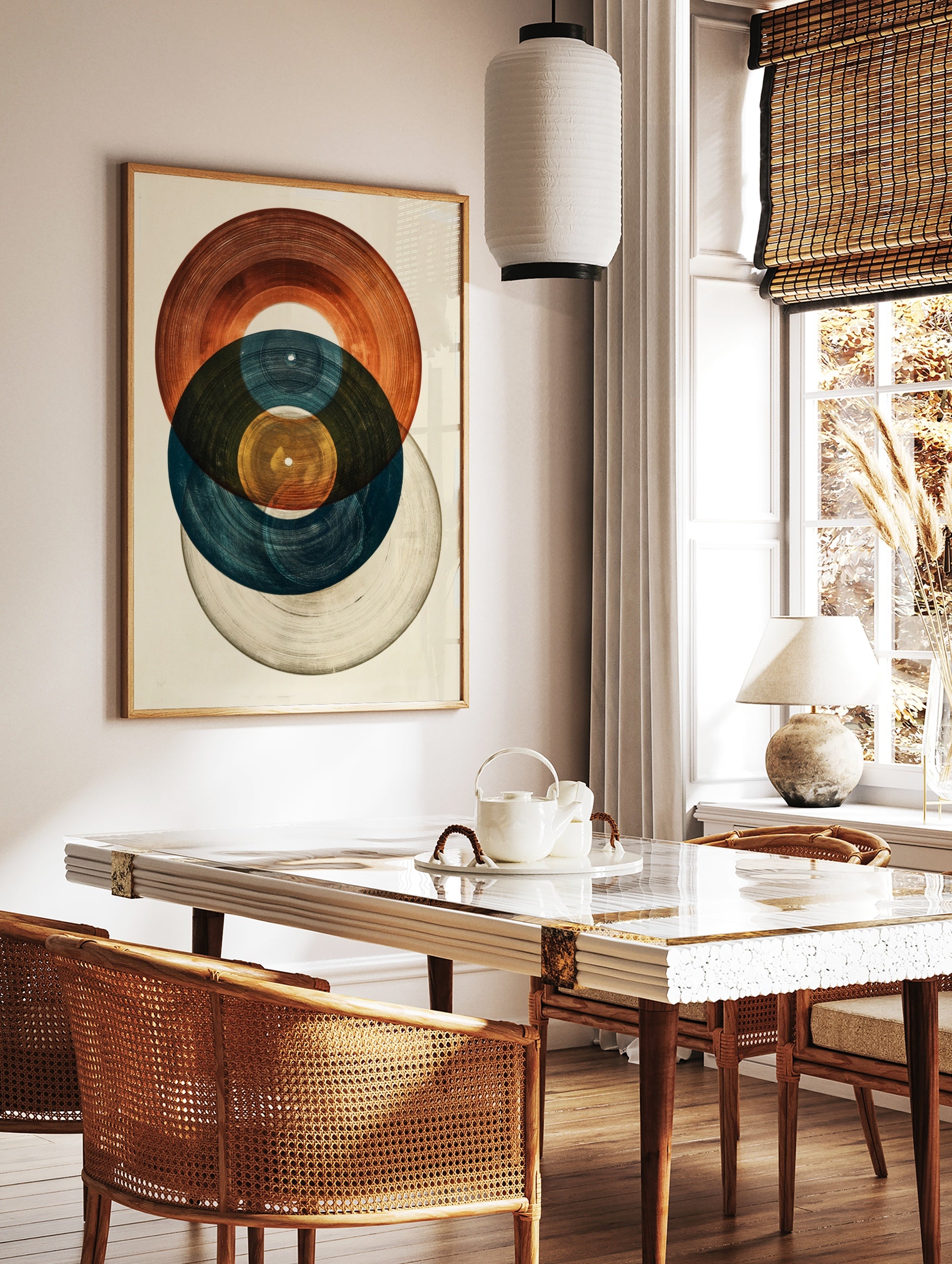 Abstract art print featuring three overlapping vinyl records in blue, brown, and grey tones on a, in a styled room mockup
