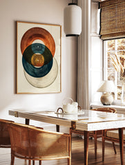 Abstract art print featuring three overlapping vinyl records in blue, brown, and grey tones on a, in a styled room mockup