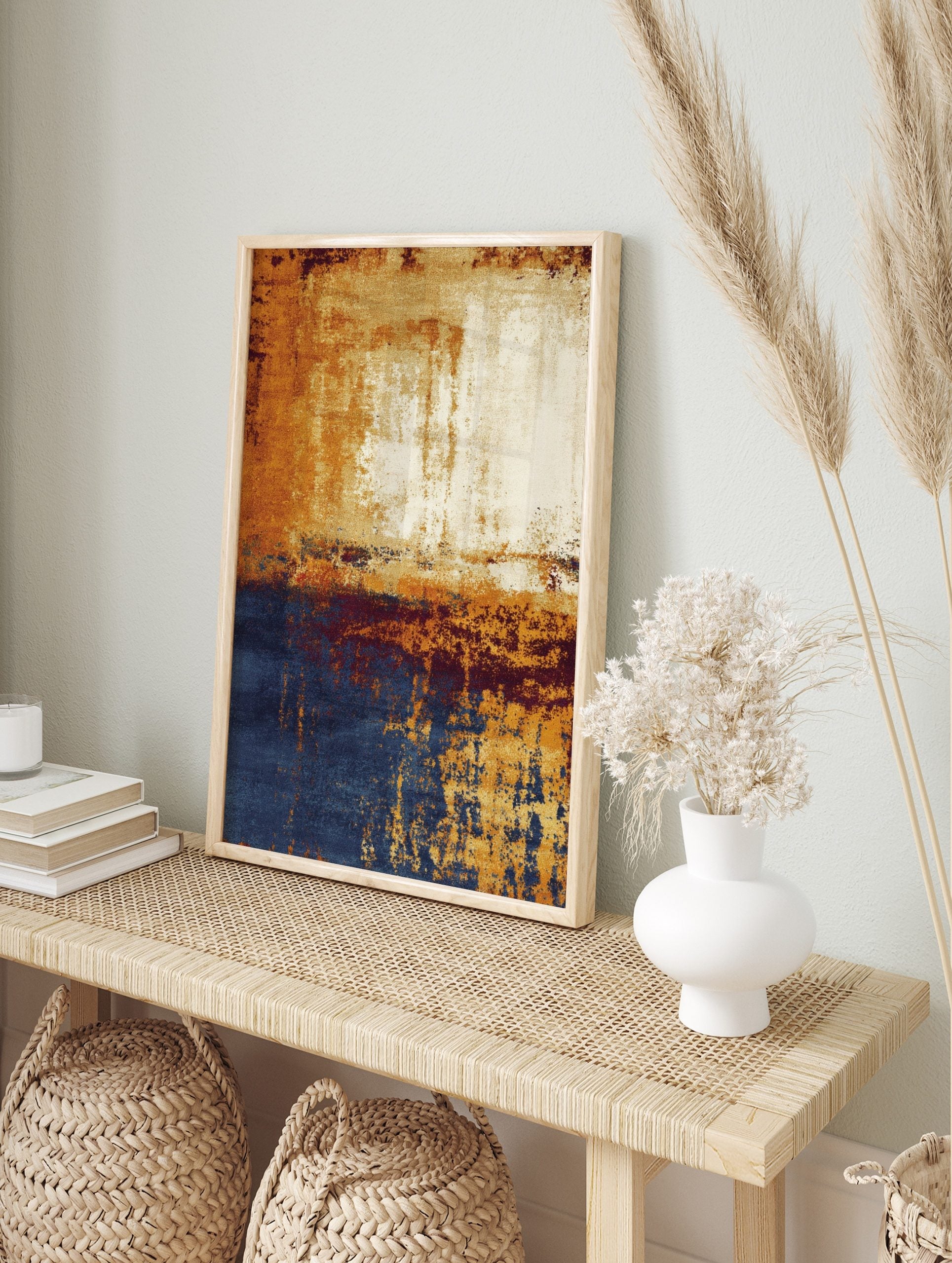 Abstract wall art with golden orange, deep blue, and cream distressed textures in a vertical, in an alternate framed mockup
