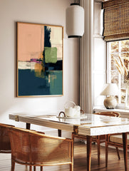 Abstract art print with blocks of peach, navy, green, ochre, and white, featuring thin black lines, in a styled room mockup