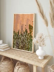 Abstract wall art with vertical orange and green lines, suggesting a modern cityscape or landscape with white dappled light. - Image 3